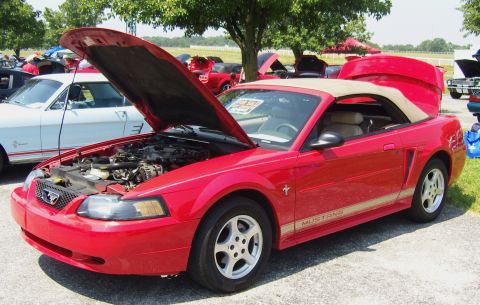 2007 Ford Mustang - A red convertible Mustang is displayed with its hood and trunk open, revealing the engine and interior.