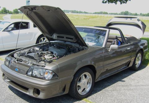 2007 Ford Mustang - Brown 1990 Ford Mustang convertible with hood and trunk open, parked outdoors.