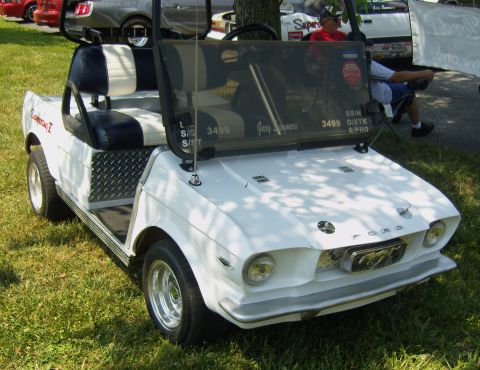 2007 Ford Mustang - Golf cart modified to look like a 1967 Ford Mustang, parked on grass with other vehicles nearby.