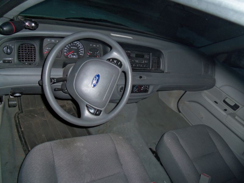 Interior view of a Ford car, showing the steering wheel and dashboard