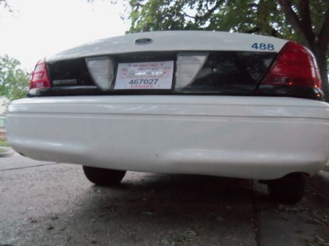 2000 Mercury Grand Marquis - This 2000 Mercury Grand Marquis police car is seen from the rear, displaying its unit number and a Kansas license plate.
