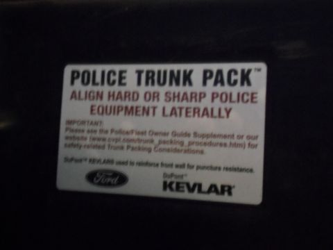 2000 Mercury Grand Marquis - Sticker details police trunk pack instructions and logos for Ford and DuPont Kevlar.