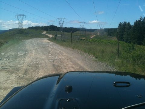 2005 Jeep Wrangler - Driving on a dirt road with power lines overhead and trees on the side.