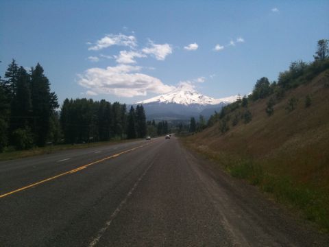 2005 Jeep Wrangler - Driving on a highway with a mountain view on a clear day.