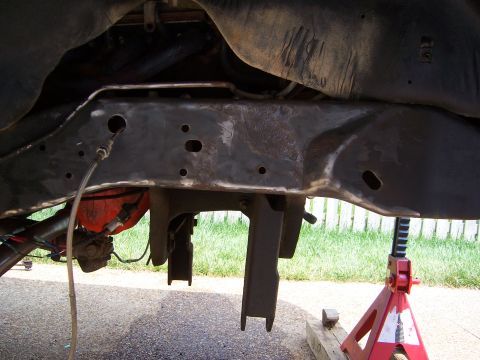 1992 Ford Bronco - Close-up view of the vehicle's undercarriage, focusing on the frame and suspension system.