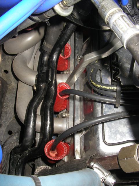 1990 Ford Bronco - Spark plug wires with red protective sleeves are visible in the engine compartment.