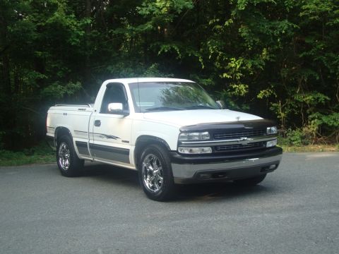 2002 Chevrolet Silverado 1500 - This 2002 Chevrolet Silverado 1500 pickup truck is shown from the front three-quarter view, parked outdoors.