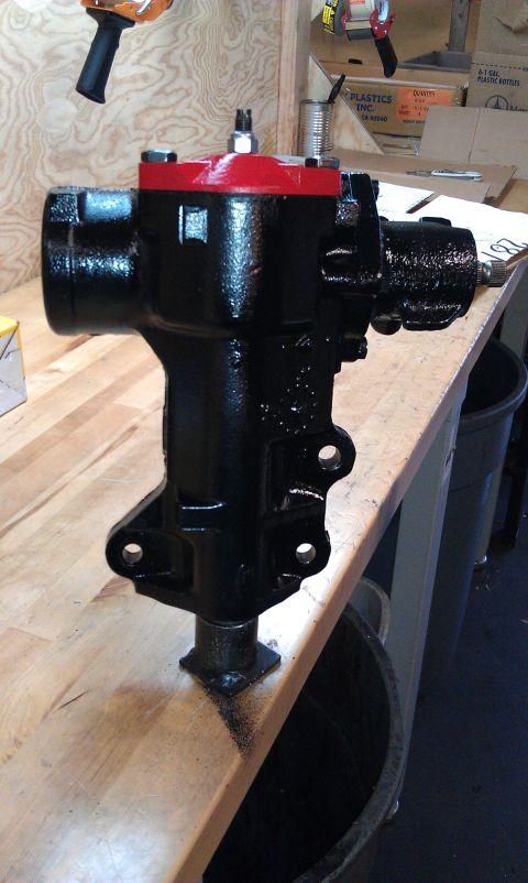 1990 Ford Bronco - A black steering gear box with a red top is shown, likely a replacement part for a vehicle.