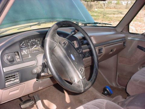1992 Ford Bronco - Interior view of a 1992 Ford Bronco, showing the dashboard, steering wheel, and seats.