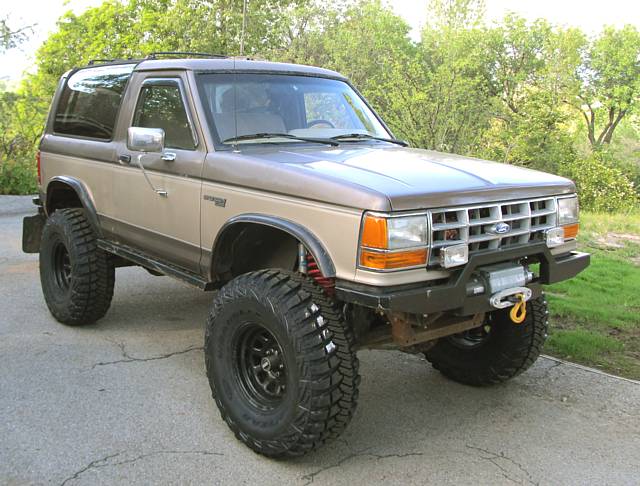 New 35x12.50R15 Goodyear MT/R w/Kevlar tires.

Finally got rid of those old chewed-up BFGs.
The BFGs never let me down on performance, but for some reason the treads on them really took a beating, losing entire blocks and even exposing the steel cords in a couple places. Hoping these MT/R-Ks hold up a bit better.

Edit 12-22-13:
The MT/Rs did exceptionally well offroad, however for some reason they became very out of round as time went on (as bad as Super Swampers), so I had to get rid of them since I drive on the road a lot. Too bad, they were wearing well too... 14K miles and still had almost 70% tread left.