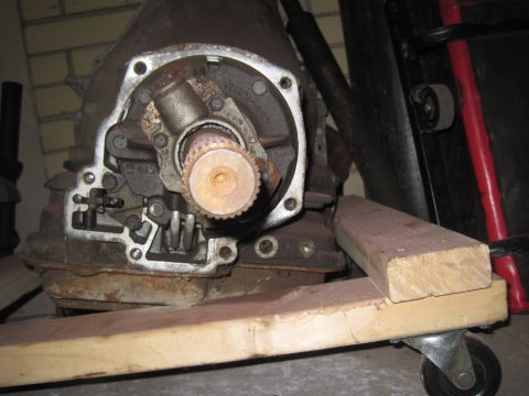 1979 Ford Bronco - A close-up view of a transmission part, showing its internal components and a splined shaft.