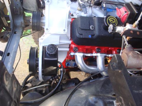 1989 Ford Bronco - Close-up view of a rebuilt engine, highlighting its components and fresh paint.
