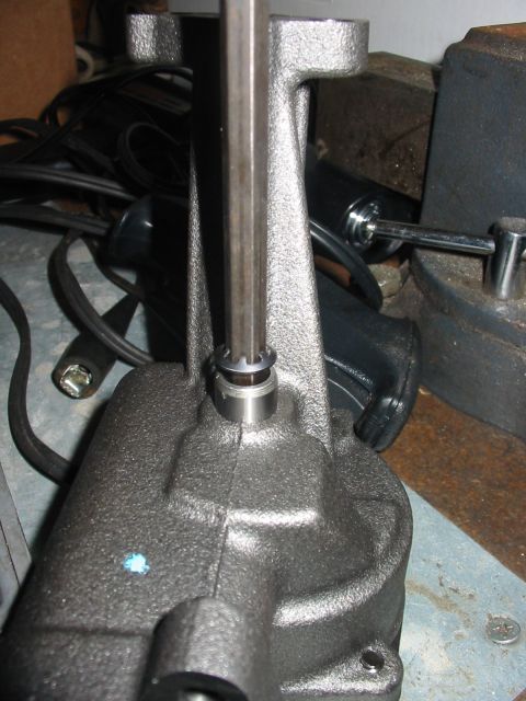 1992 Ford Bronco - Close-up of a metal component with a hex wrench being inserted into it.