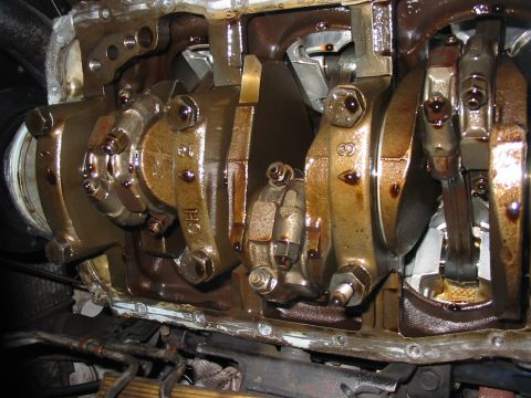 1992 Ford Bronco - Close-up view of an engine's internal components, including the crankshaft and connecting rods.