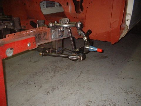 1964 Ford Fairlane - Front suspension components are visible on a car undergoing restoration.