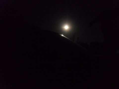 2000 Mercury Grand Marquis - A car's roofline is illuminated by a bright moon in this nighttime photograph.