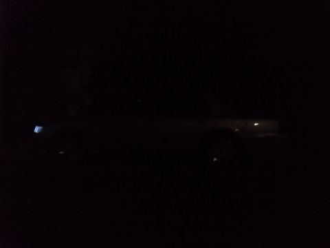 2000 Mercury Grand Marquis - A 2000 Mercury Grand Marquis is seen from the side in this nighttime photograph.