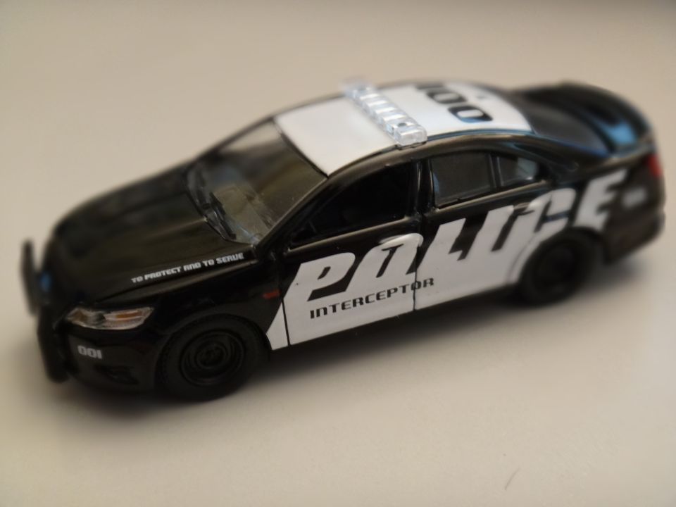 Black and white police car with light bar
