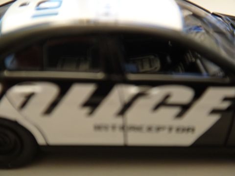 1993 Ford Taurus - A police car with "POLICE INTERCEPTOR" text is visible in a side profile.