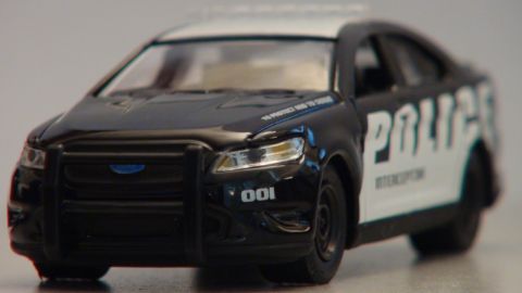 1993 Ford Taurus - A police car model with "POLICE INTERCEPTOR" text is shown from a 3/4 front angle.