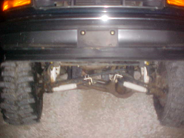 Rear axle, suspension components, and large tire of a truck