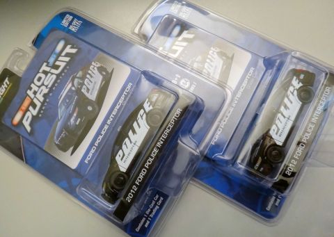 1993 Ford Taurus - Die-cast models of Ford Police Interceptors are displayed in their packaging.