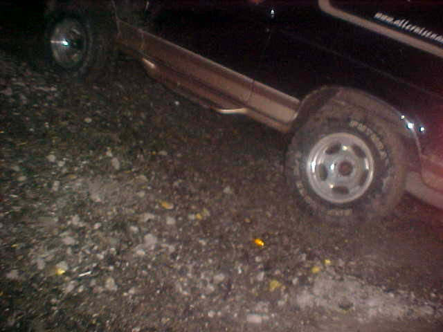 1996 Ford Bronco side view, parked on gravel
