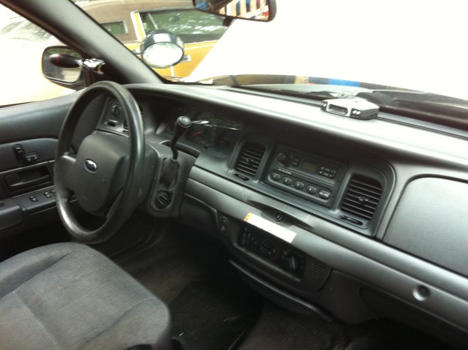 Interior dashboard and steering wheel of a Ford Crown Victoria