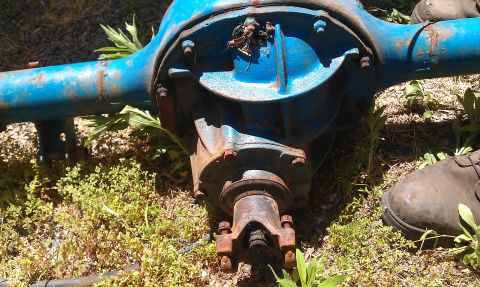 1992 Ford Ranger - Rear axle differential assembly, likely from a truck or older vehicle, sits on the ground.