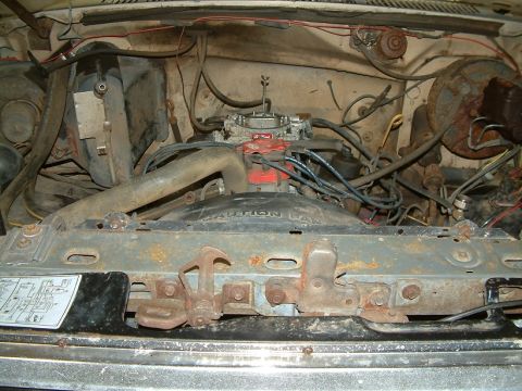 1983 Ford Bronco - A view of the engine bay, showing the carburetor and various engine components.