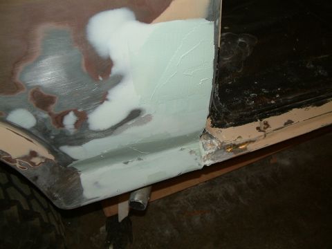 1983 Ford Bronco - Body panel repair in progress, showing application of body filler and primer.