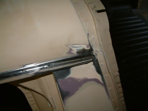 1983 Ford Bronco - Body panel shows signs of repair work, including primer and metal filler.