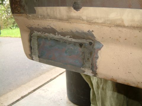 1983 Ford Bronco - A metal patch has been welded onto the vehicle's body, indicating repair work has been done.