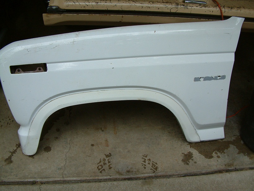 White Ford Bronco fender with 'BRONCO' badge visible