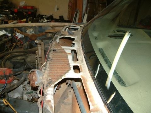 1983 Ford Bronco - This 1983 Ford Bronco shows significant rust damage in the engine bay and around the windshield frame.