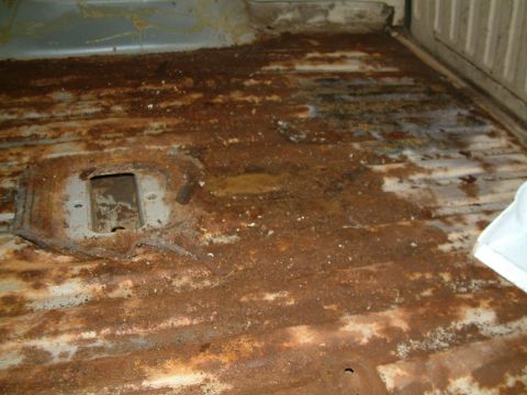 1983 Ford Bronco - The floor of this vehicle is heavily rusted and appears to be in poor condition.