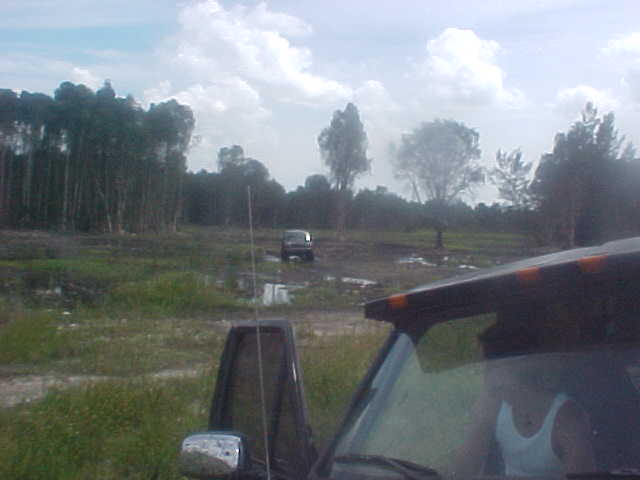 1996 Ford Bronco in a muddy field, 3q-front view