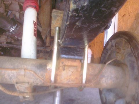 1995 Ford Bronco - Rear axle assembly with shock absorber, likely from an older vehicle.