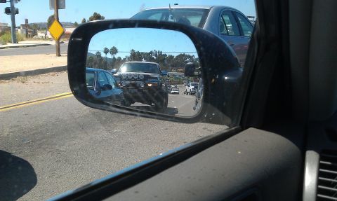 1992 Ford Ranger - View of a truck with auxiliary lights in the side mirror while driving.