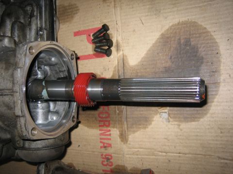 1979 Chevrolet C/K Pickup - Close-up of a driveshaft component with a red gear and bolts, likely removed for repair.