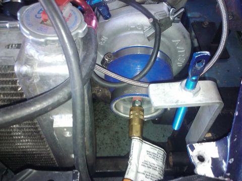 1995 Ford Probe - Engine bay components including a turbocharger and parts of the cooling system are visible.
