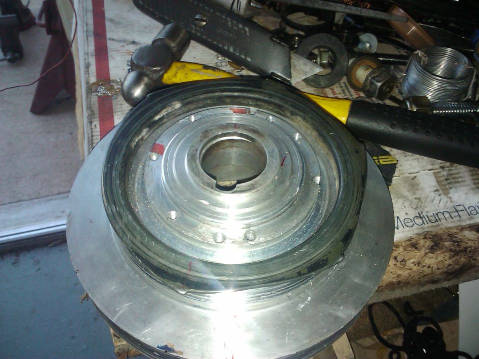 Crankshaft pulley with tools on a workbench