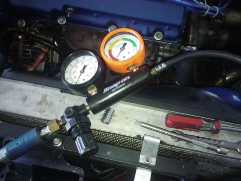1995 Ford Probe - Diagnostic tools are set up in the engine bay for testing.