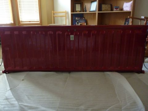 1997 Dodge 2500 - A red tailgate is shown, likely removed from a truck for repair or replacement.