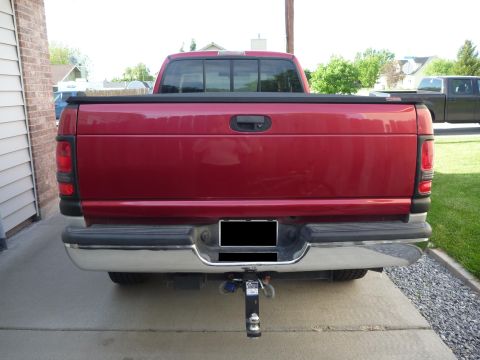 1997 Dodge 2500 - Rear view of a red 1997 Dodge 2500 pickup truck, equipped with a trailer hitch.