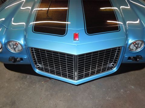 1972 Chevrolet Camaro - Front view of a blue 1972 Chevrolet Camaro, showing its distinctive grille and headlights.