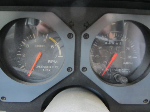 1985 Ford Mustang - Dashboard gauges for a 1985 Ford Mustang, showing RPM and MPH readings.