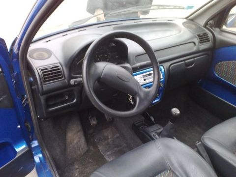 1991 Ford LTD Crown Victoria - Interior view of a blue car, showing the dashboard, steering wheel, and seats.