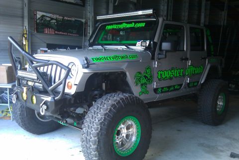 1967 Ford Mustang - This modified Jeep Wrangler features custom graphics and off-road modifications, including a light bar and heavy-duty bumper.