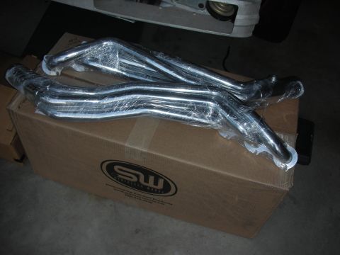 1992 Ford Crown Victoria - Chrome exhaust headers are packaged on a box with a performance exhaust systems logo.